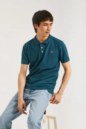 Polo azul índigo piqué con tapeta de tres botones y detalle Polo Club